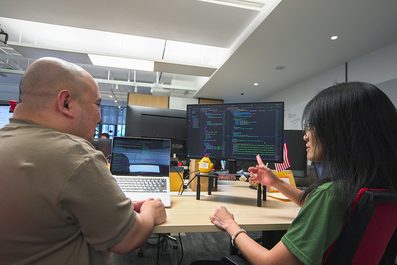IQI employees working together in the office