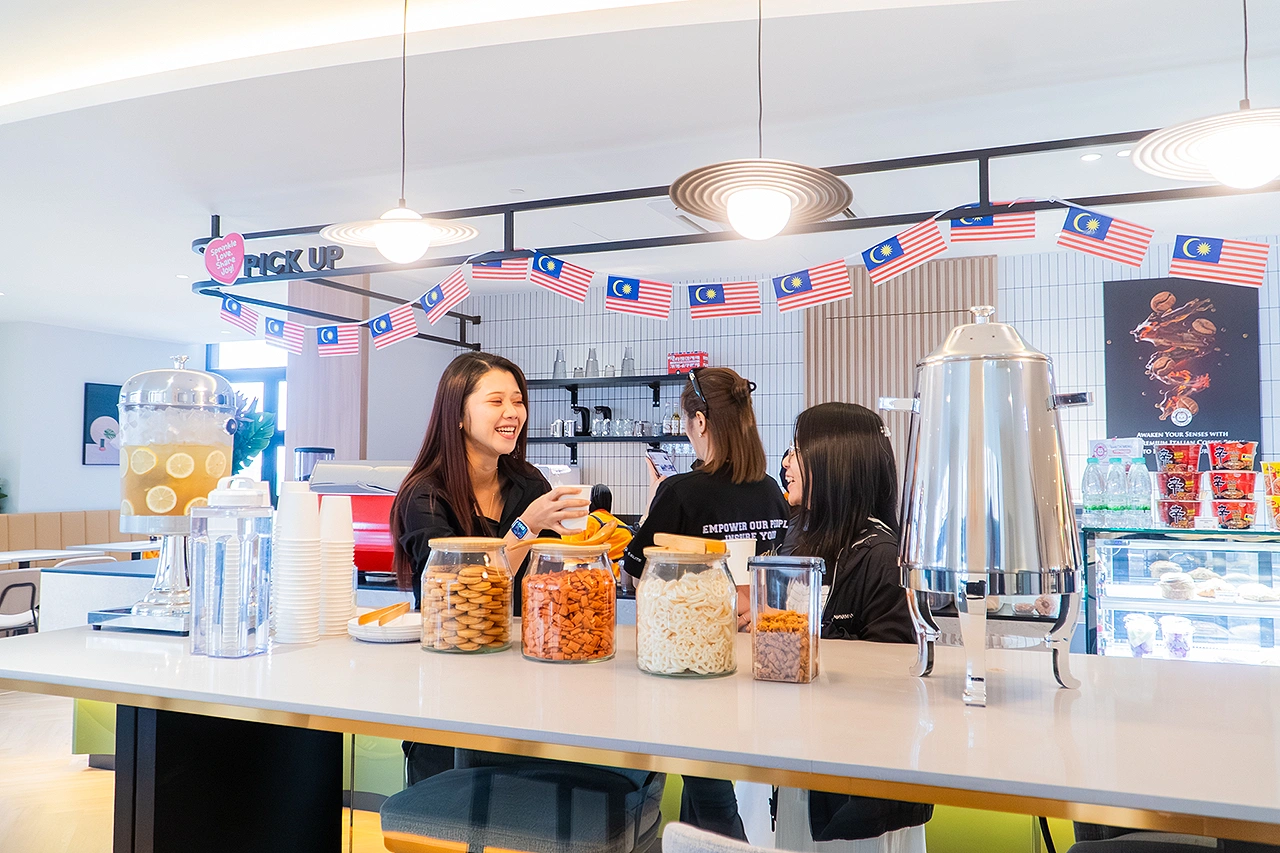 IQI Global employees having fun at pantry