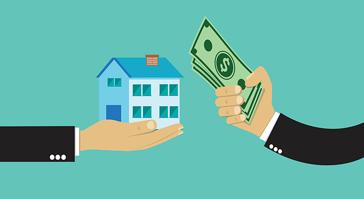 Real estate man holding a house and dollars.