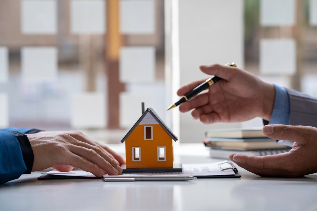 two persons discussing buying a land. 