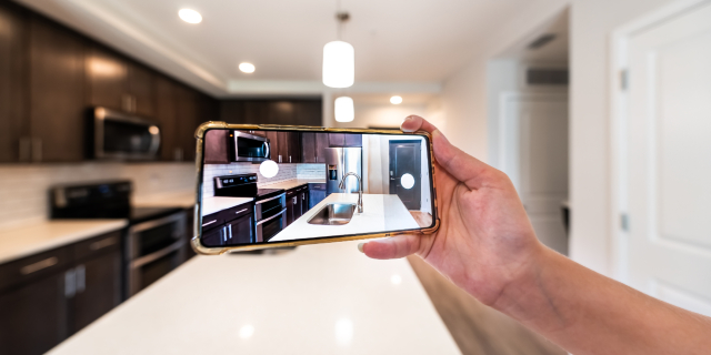 Real estate agent taking photo to upload on linkedin