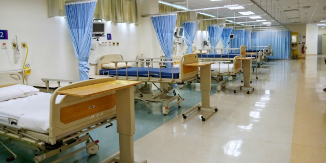 a hospital full with beds and medical equipment