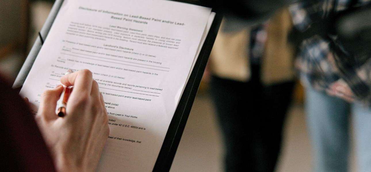 A girl is signing document of sales and leaseback agreement